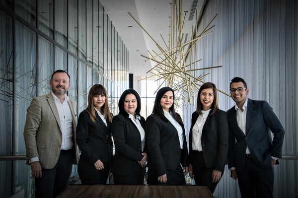 Group of people dressed in suits