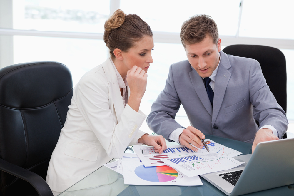 Workers discussing payroll