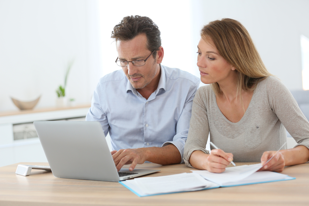 Man and woman doing taxes together